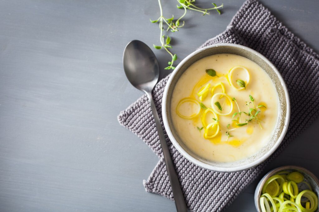 creamy potato and leek soup in bowl