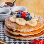Fluffy pancakes with berries for breakfast